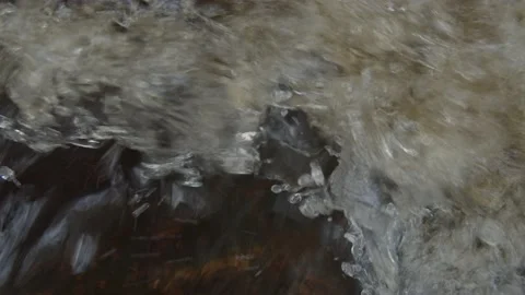 Extreme close up slow motion of bubbling stream and waterfall Stock Footage 146266049