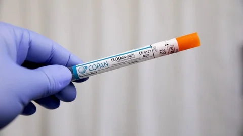 Extreme Close Up Slow Motion of Gloved Hands Opening Flexible COVID 19 Swab Video stock 129416147