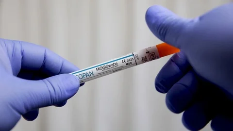 Extreme Close Up Slow Motion of Gloved Hands Opening COVID 19 Swab Stock Footage 129416448