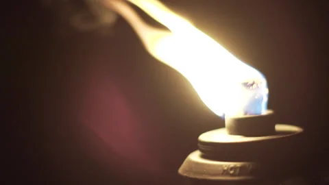 Extreme Close-Up Slow-Motion Handheld Shot of a Tiki Torch Flame Stock Footage 316562095