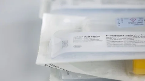 Extreme Close Up Slow Motion Pan of Pile of COVID Swabs and Tubes Video stock 129416186