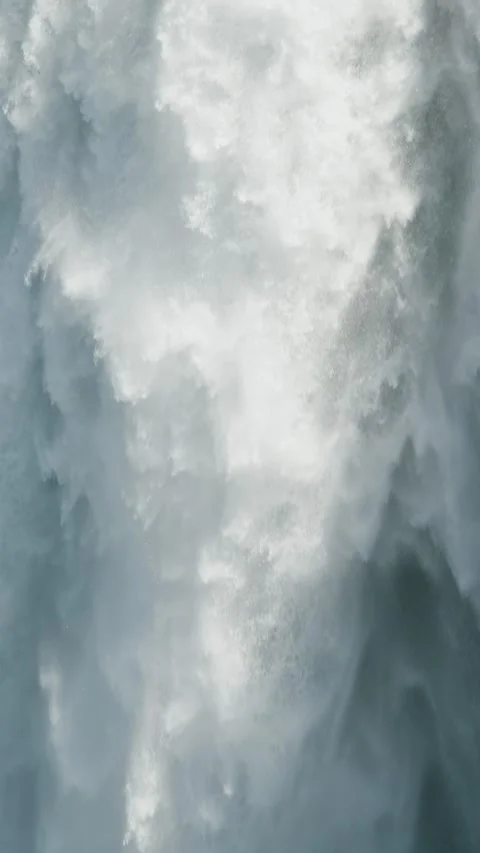 Extreme close-up slow motion of rushing waterfall in vertical format. Pure Stock Footage 337167207
