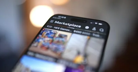 Extreme close-up of a smartphone screen displaying the Facebook Marketplace app Stock Footage 333705710
