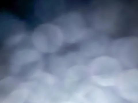 Extreme close-up of soft, dreamy cloud bokeh at dusk, with dark navy sky 写真素材