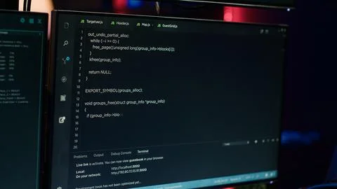 Extreme close up of software interface on PC screens showing lines of code 스톡 사진