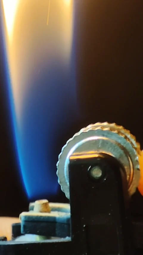 Extreme Close-up Spark and Blue Flame from Gas Lighter Stock Footage 345573153
