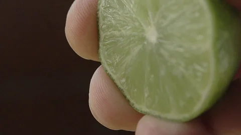 EXTREME CLOSE UP OF A SQUEEZE LEMON Stock Footage 107301904