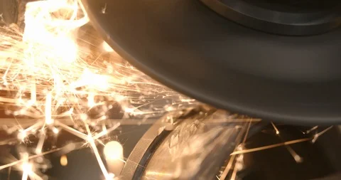 Extreme close up steel worker with angle grinder making hot glowing sparks 스톡 동영상 120618763