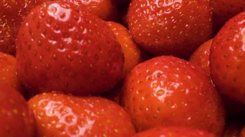 Extreme close-up of strawberries captured with a sliding motion. Stock Footage 313802471