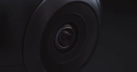 Extreme close-up of a surveillance camera watching and tracking Stock Footage 121017737