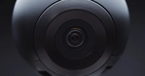 Extreme close-up of a surveillance camera watching and tracking Stock Footage 121017903