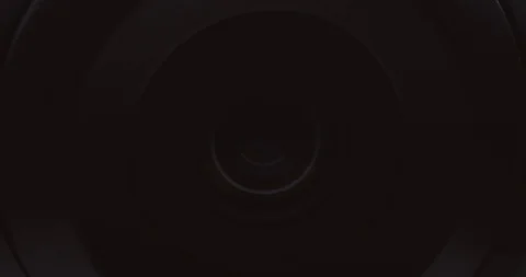 Extreme close-up of a surveillance camera watching and tracking Stock Footage 121017989