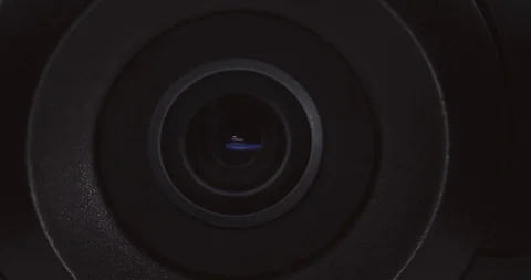 Extreme close-up of a surveillance camera watching and tracking Stock Footage 121018012