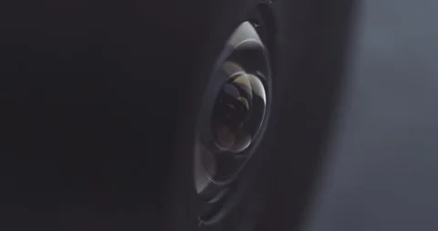 Extreme close-up of a surveillance camera watching and tracking Stock Footage 121018236