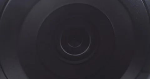 Extreme close-up of a surveillance camera watching and tracking Stock Footage 121018262