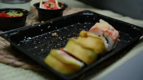 Extreme close-up of a takeaway container filled with sushi rolls Stock-Footage 347155693