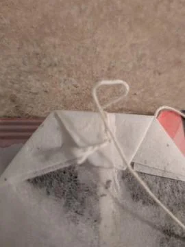 Extreme close-up of tea bag stitching and string detail Stock Photos