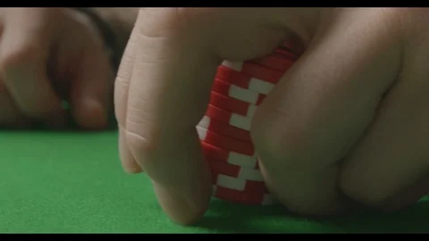 Extreme close-up of throwing red poker chips on the green table Stock Footage 125982633