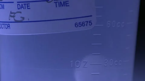 Extreme close up tilt down specimen container Stock Footage 20447988