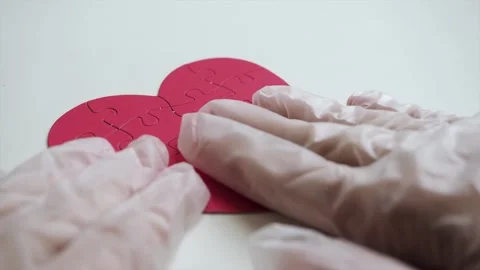 Extreme close up. Top view of woman's hands in white latex medical gloves are Stock Footage 153487589
