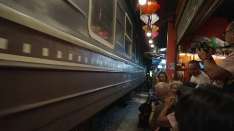 Extreme Close-up of Train Passing Through Residential Street in Hanoi. Stock Footage 323765575