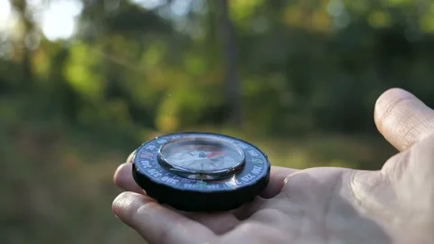 Extreme close-up of a transparent modern compas in the forest background. Stock-Footage 139655188