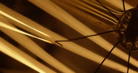 Extreme close up of tungsten Edison light bulb. Abstract moving background. Stock Footage 146676402