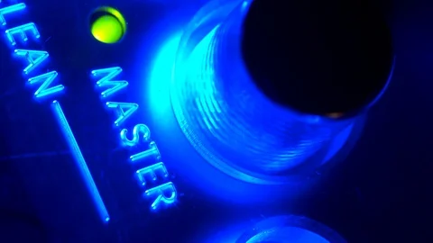 Extreme close-up turning button master with green indicator on volume console 動画素材 103548677