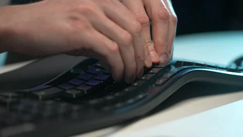 Extreme close-up of unrecognizable man assembling disassembled keyboard after Stock Footage 238977662