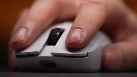 Extreme close-up of unrecognizable man using modern wireless mouse working on Stock Footage 263238133