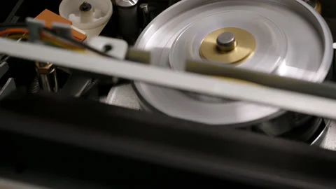 Extreme close up VHS video cassette insert in recorder in VCR player. Tape play Stock Footage 219905717