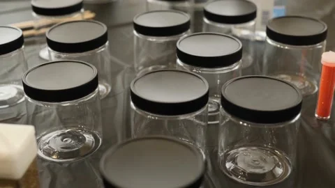 Extreme close up video of empty small bottles Video stock 143969126