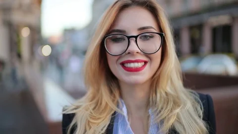 Extreme close up view of a beautiful blonde woman in a formal trendy look, with Video stock 76909562
