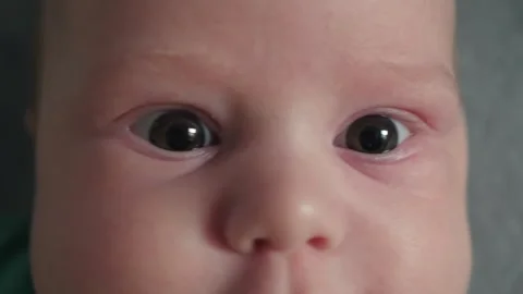 Extreme close view of infant face with curious eyes Stock Footage 341040067