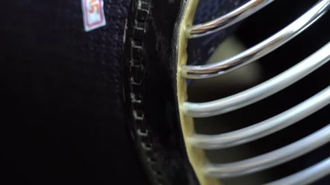 Extreme close view of the lacquered stitched rim and polished bars of a Vídeo Stock 346737840