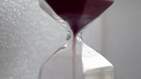 Extreme Close Up View Of Pink Sand Particles Flowing Through An Hourglass. Stock Footage 240690975