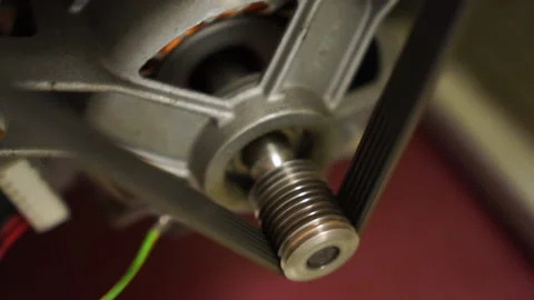 Extreme close up of washing laundry machine electric motor shaft spindle Video stock 130473803