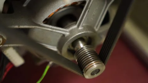 Extreme close up of washing laundry machine electric motor shaft spindle and Video stock 153932075