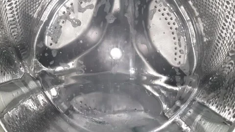 Extreme close-up of washing machine drum III, empty wash - medium speed Stock Footage 302893970