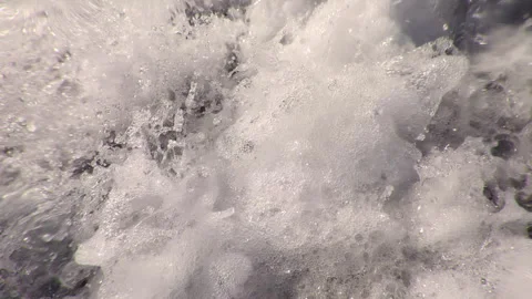 Extreme close-up of waterfall below, rushing stream of falling water foaming and Stock Footage 326327726