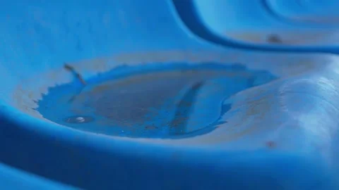 Extreme Close-Up of Weathered Blue Stadium Seat With Cracked Hole and Rust Marks 스톡 동영상 346654111