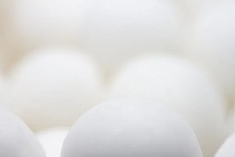Extreme close up of white small peppermint candy balls Foto stock