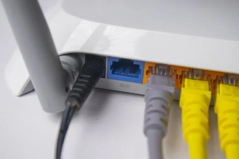 Extreme close-up of a white wireless router back panel, showing the labelle.. Stock Photos