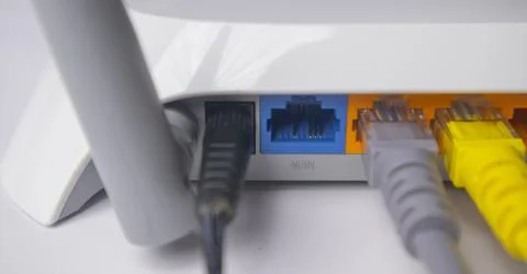 Extreme close-up of a white wireless router back panel, highlighting the la.. Stock Photos