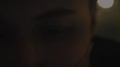Extreme close-up of a woman's eye in warm candlelight... 스톡 동영상 339101291