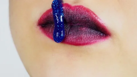 Extreme close-up of a woman's lips. Vídeo Stock 112957629