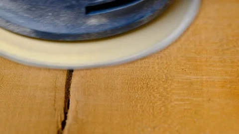 Extreme close up of wood being sanded with an electric sander Stock Footage 138947958