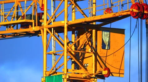 Extreme close-up of working tower crane cabin at sunset Видео 943268