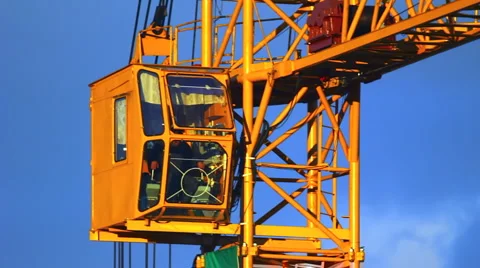 Extreme close-up of working tower crane cabin at sunset 库存影片 944425