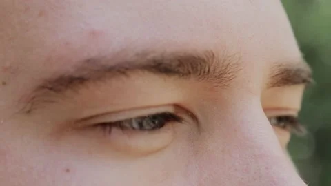 Extreme close up of young caucasian man looking depressed Stock Footage